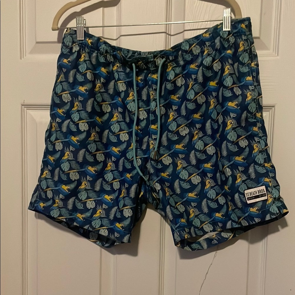 Beach bros blue parrot leaf pattern swim trunks, size large